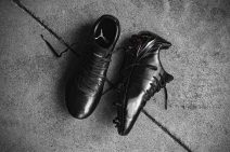 Black Puma shoes on a concrete background. 